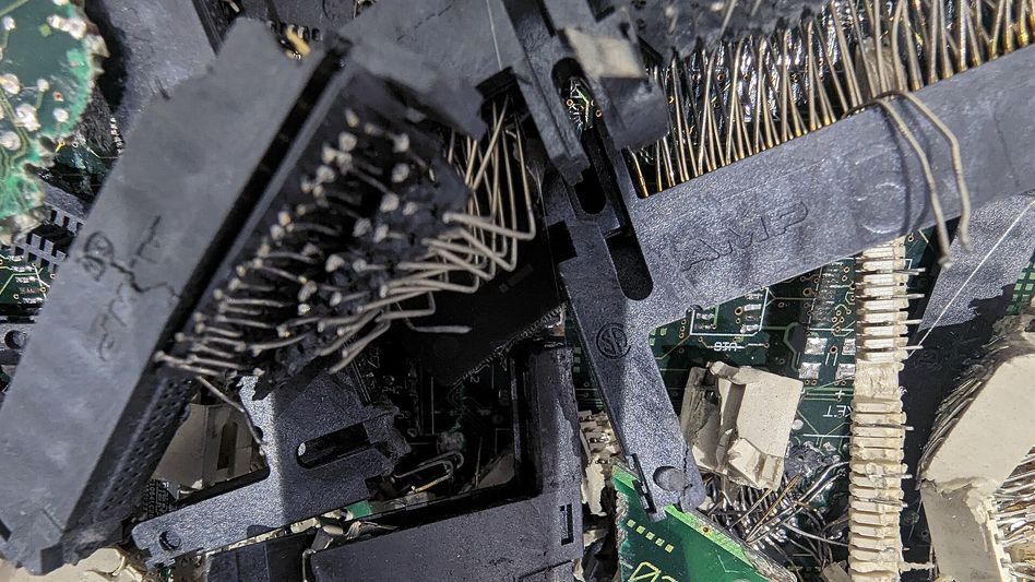 Racks of decommissioned enterprise servers staged for audited teardown at an ITAD facility